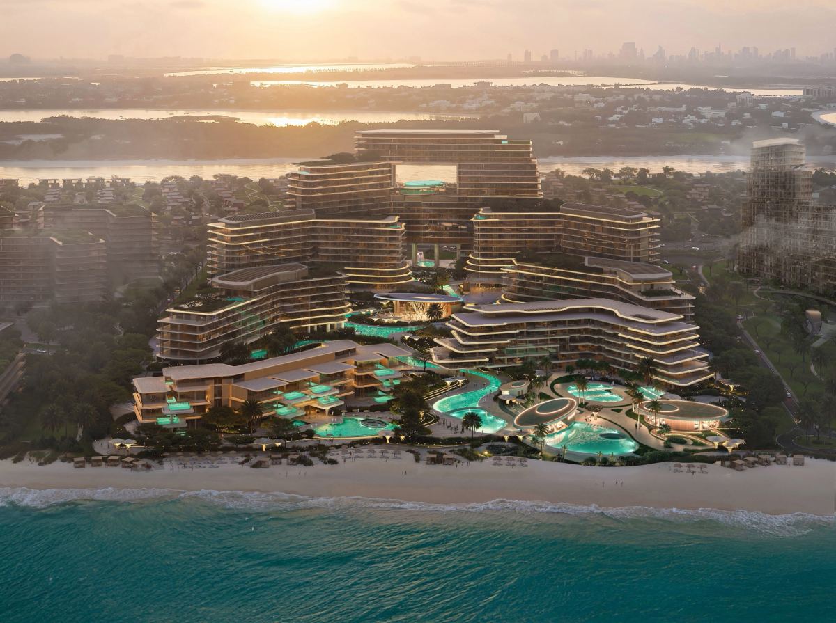 The Meriva Collection at sunrise, showing the curved terraces of Meriva Sunset above the pool decks.