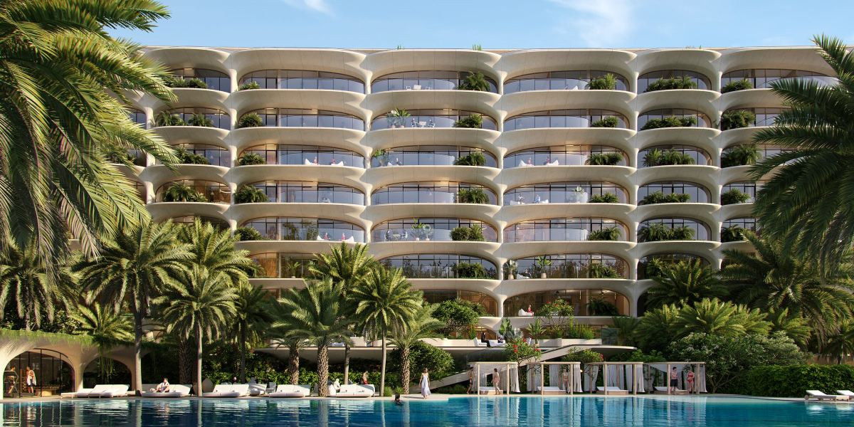 Ocean House by Ellington on Palm Jumeirah, seen across the Olympic pool and its gardens.