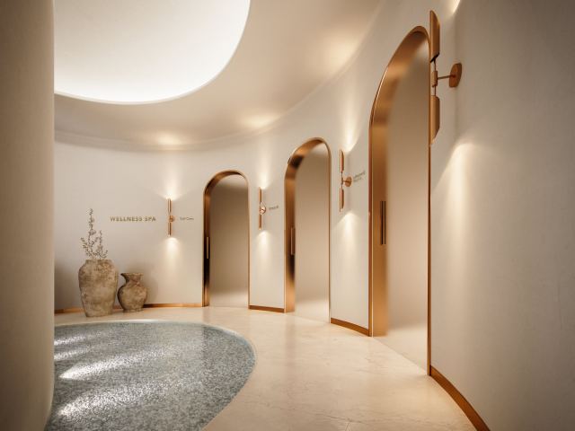 The entrance to the wellness spa at Ocean House, with arched doorways in natural stone.