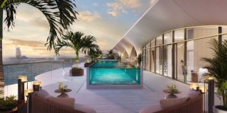 The private pool terrace of a penthouse at Ocean House, with the Burj Al Arab on the horizon.