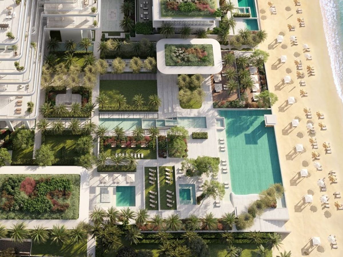 The gardens, pools and resident-only beach at ORLA seen from above.