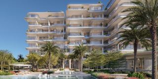 The interconnected towers of ORLA above the residents' pool and palms.