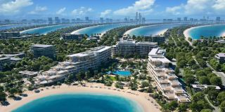Palm Central Private Residences from the air, with the infinity pool, the gardens and the beach on Palm Jebel Ali.