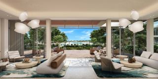 Three-bedroom living room at Palm Central, with sliding doors folded back to the terrace.