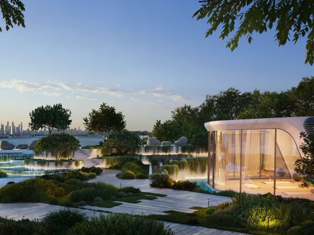 The Wellness Pavilion at Passo, a glass pavilion among gardens and water at dusk.