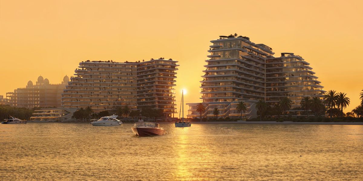 The two towers of Passo at sunset, seen from the water.