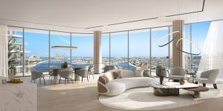 The living room of a four bedroom residence at Passo, with a wide view over Palm Jumeirah.