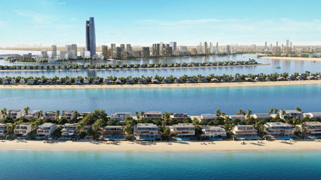 Beachfront villas along a frond at Palm Jebel Ali, with the Dubai skyline behind