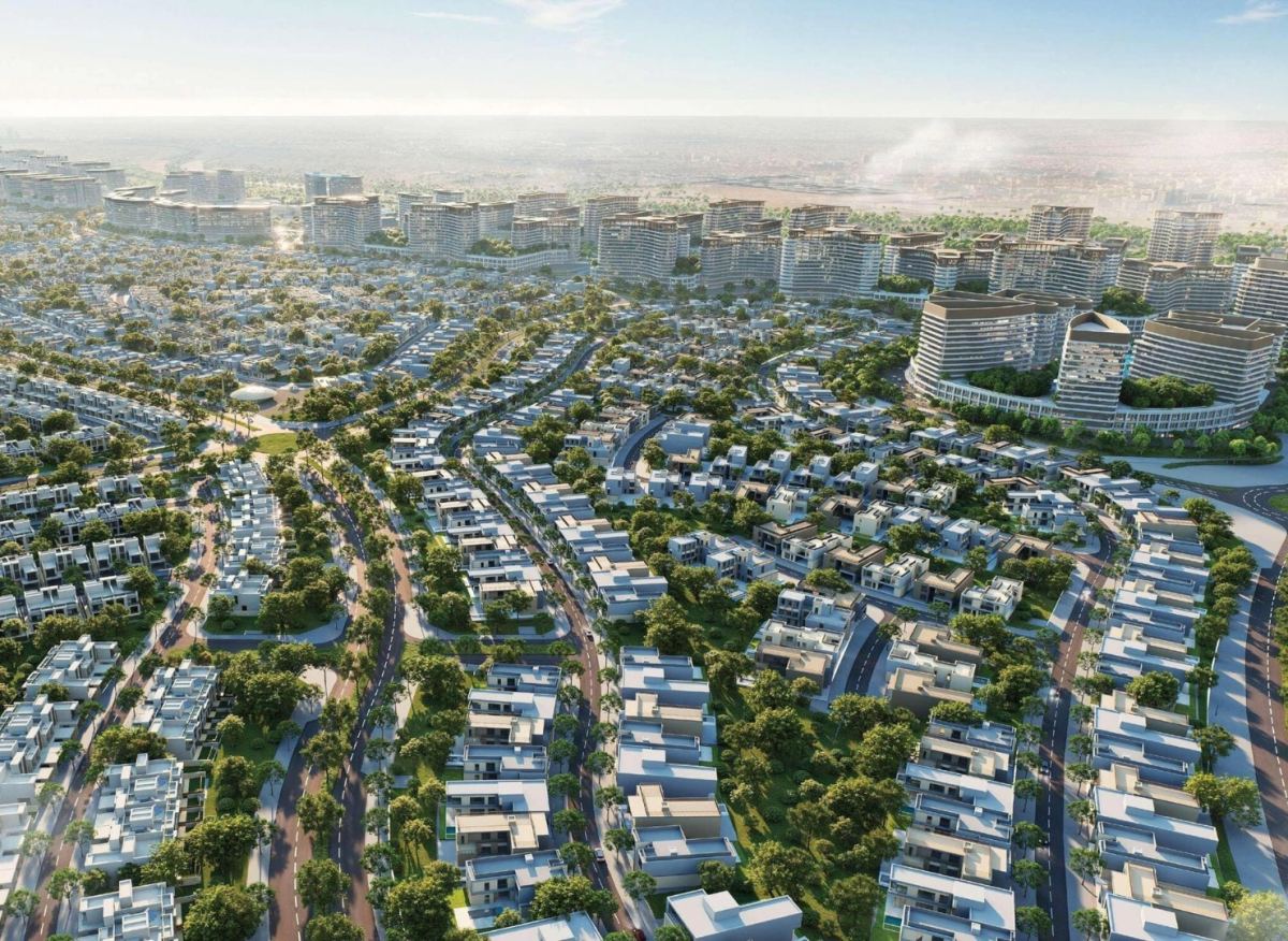 Daytime aerial view of Sobha Sanctuary's low-density villa neighbourhoods in Dubailand, with tree-lined roads and green corridors between standalone villas and townhouses.