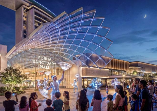 Sobha Sanctuary Mall at night, with residents gathered under its illuminated lattice canopy.