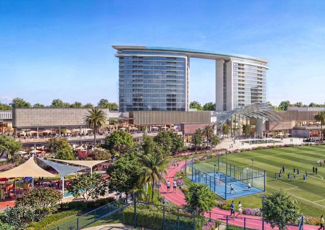 Aerial view of the sports complex at Sobha Sanctuary — padel and tennis courts, running track and playing fields.