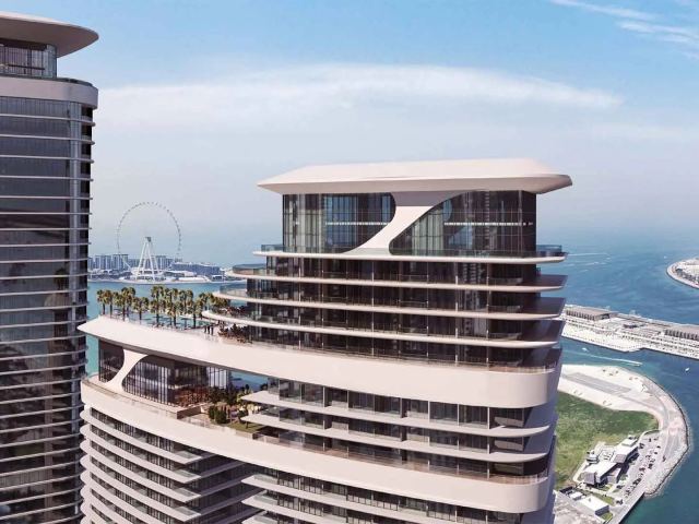 The towers of Sobha Seahaven from above, with the marina and Ain Dubai.
