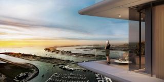 A terrace at Sobha Seahaven at sunset, the marina and the coast below.