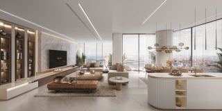 Living and dining room in an apartment at Sobha Seahaven, with the sea beyond the glass.