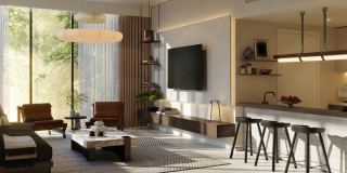 The open living room and kitchen in a residence at Sei Saadiyat.