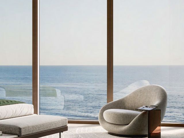 A lounge at Soulever with glazing onto the Arabian Gulf.