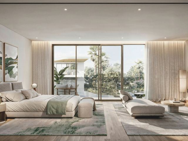 The master bedroom in a Talay villa, opening onto a balcony.