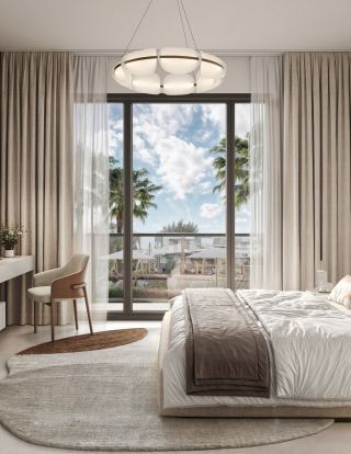 Bedroom opening to a balcony at The Wilds Residences.