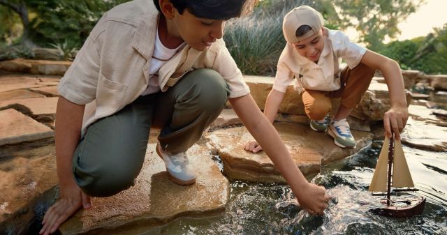 Children playing in the streams at The Wilds.