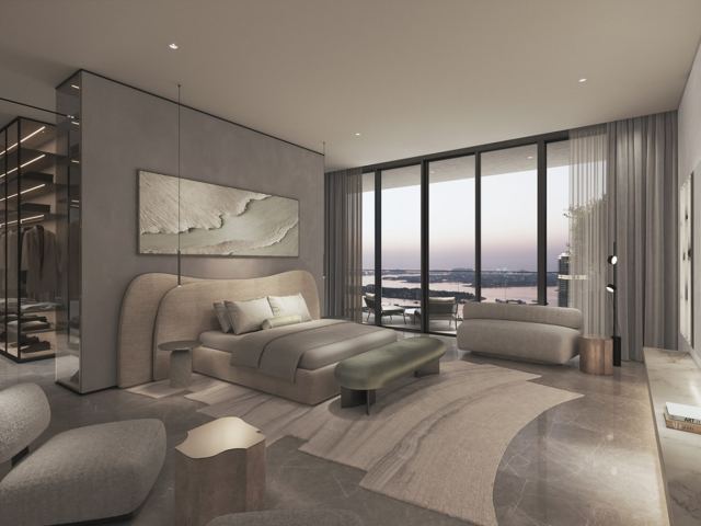 Master bedroom in a four bedroom home at W Residences at dusk.