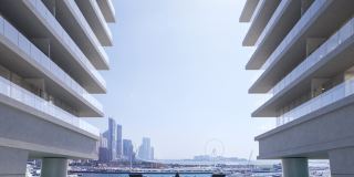 The amphitheatre between the towers at W Residences, with the W mark above the harbour.