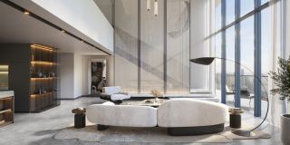 A duplex loft at W Residences, the living floor open to the water side.