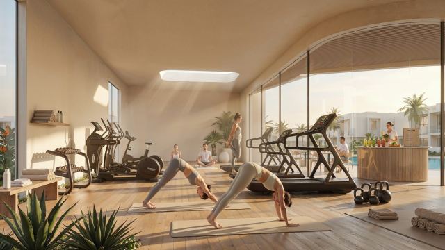 Indoor fitness area and yoga space in the Yas Riva Reserve clubhouse